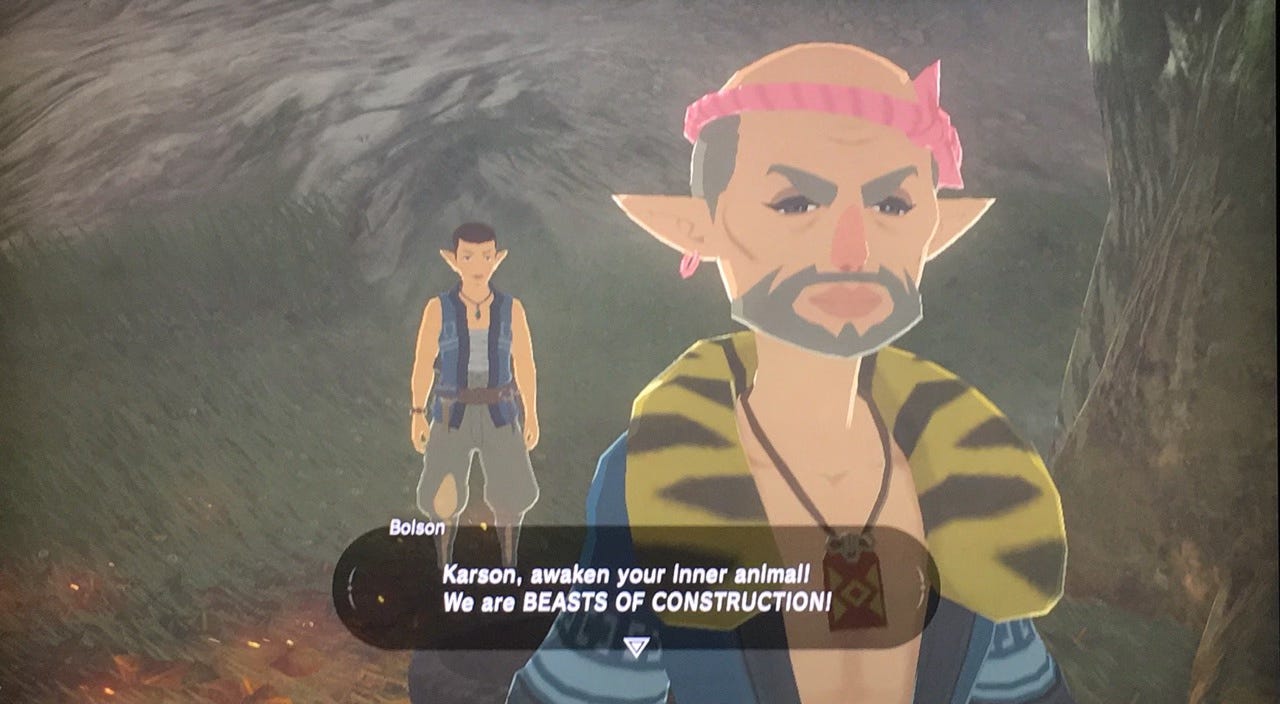 Screenshot from The Legend of Zelda: Breath of the Wild showing Bolson, a cartoon character with pointed ears, pink headband, and yellow striped shirt in the foreground. Behind him stands his employee Karson. A dialog box displays Bolson's catchphrase: 'Karson, awaken your inner animal! We are BEASTS OF CONSTRUCTION!' This image references the game's construction company that builds homes for the player character.
