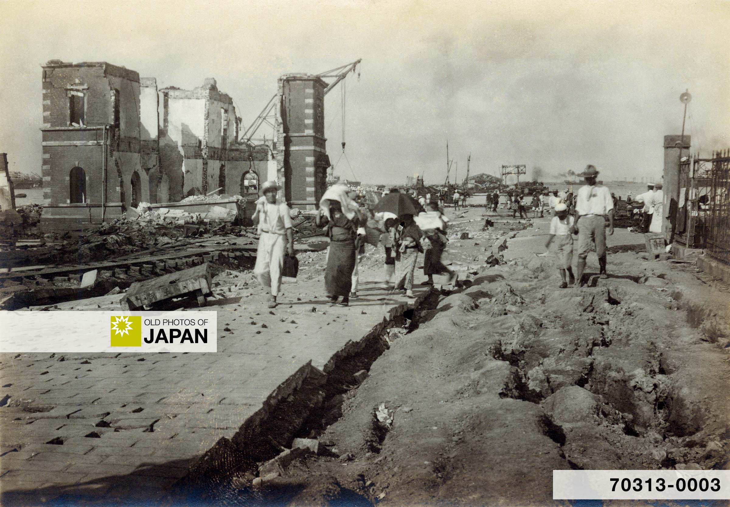 People walk at the entrance to Yokohama Pier shortly after the earthquake of September 1, 1923