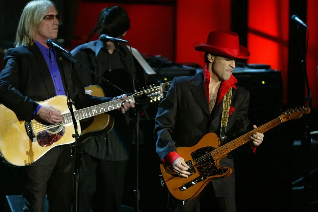 Tom Petty, left, and Prince honoring George Harrison at the Rock and Roll Hall of Fame induction ceremony in New York in March 2004.