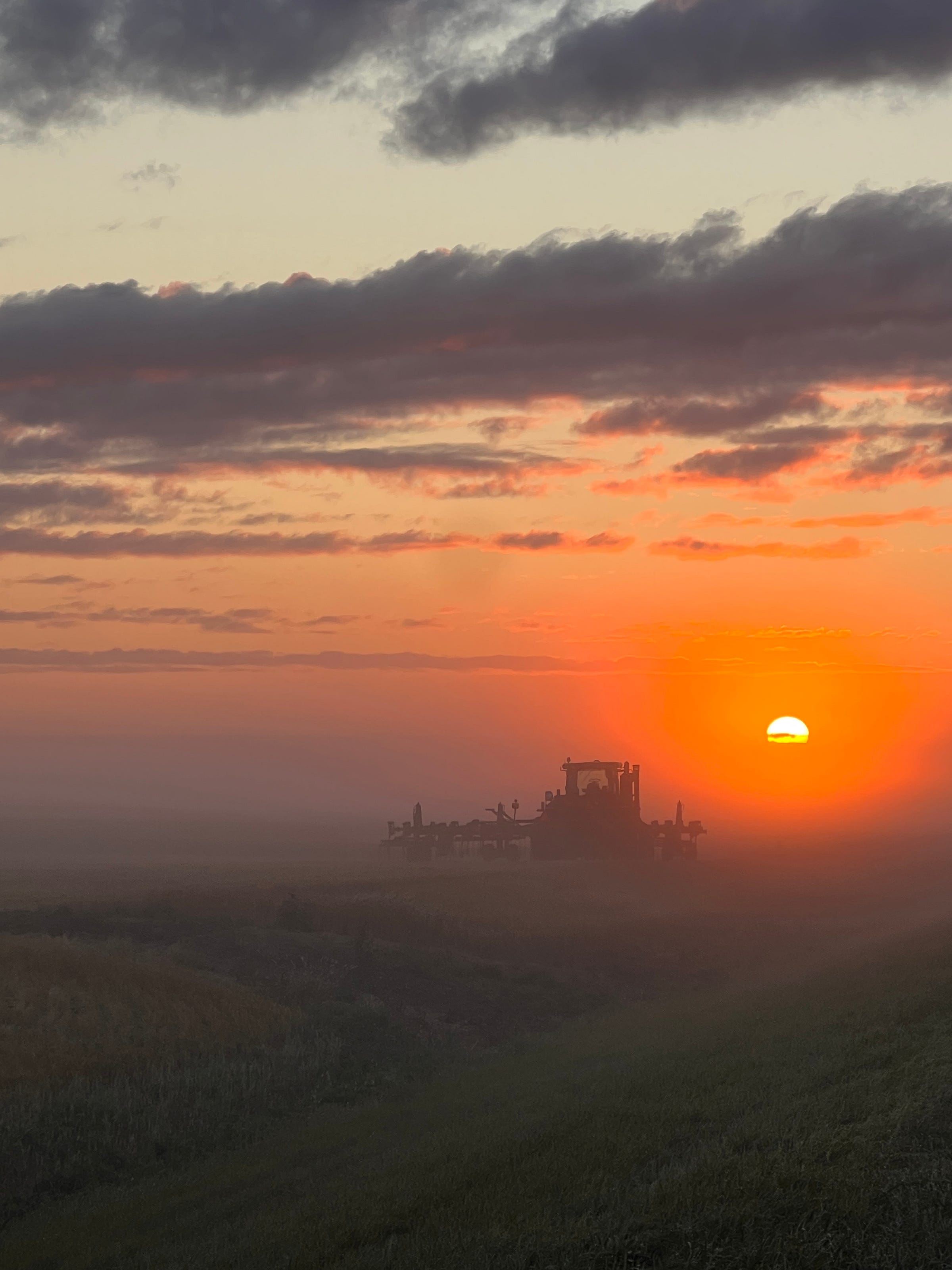 Tractor in a Smoky Sunseet