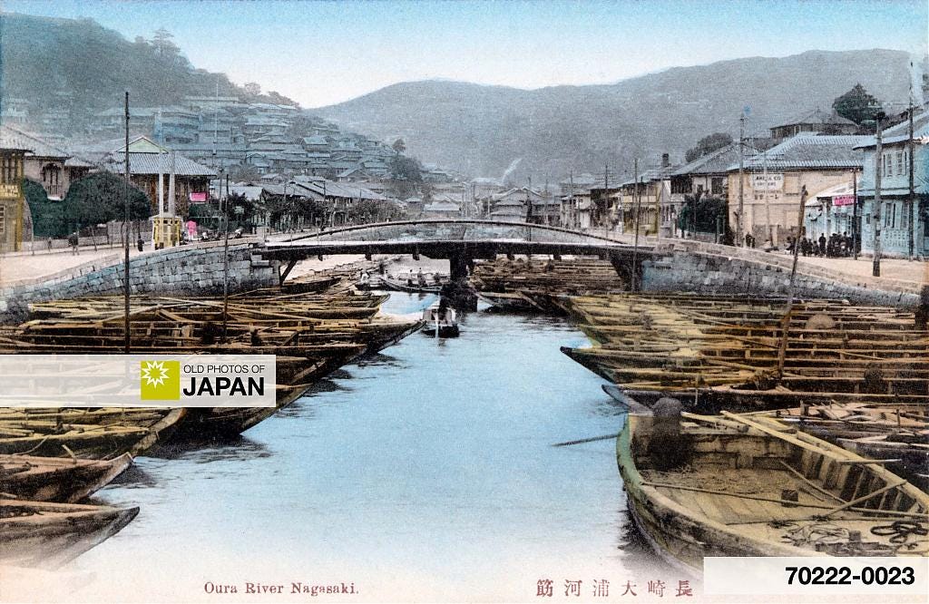 Empty danpei-bune coal barges on the Oura River in Nagasaki's Oura foreign settlement, ca. 1900s