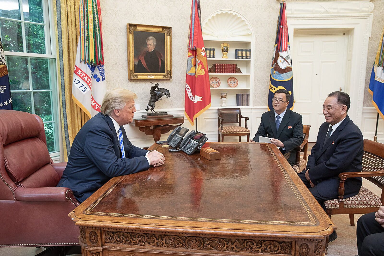 President Donald Trump meeting with a North Korean envoy in the Oval Office with Andrew Jackson’s portrait on the wall in the background