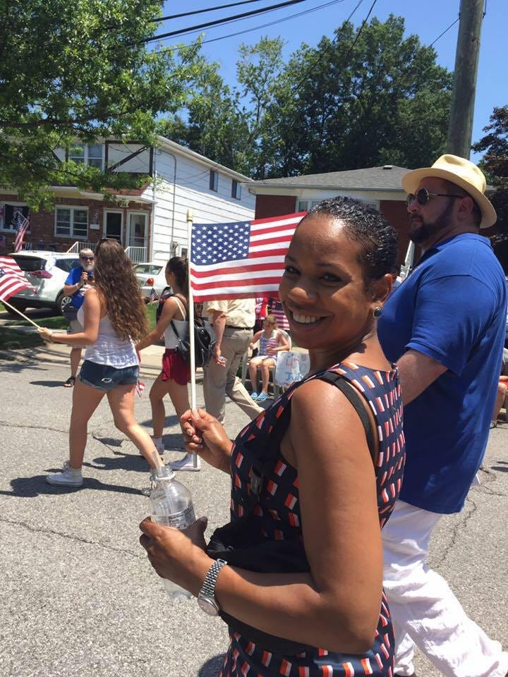 Kamillah Hanks [c] campaigns with Richard Luthmann [r] at the 2017 Fourth of July Parade in Travis, Staten Island.