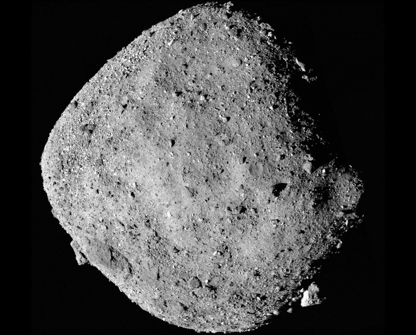 Bennus is a diamond-shaped gray asteroid, covered in rubble.