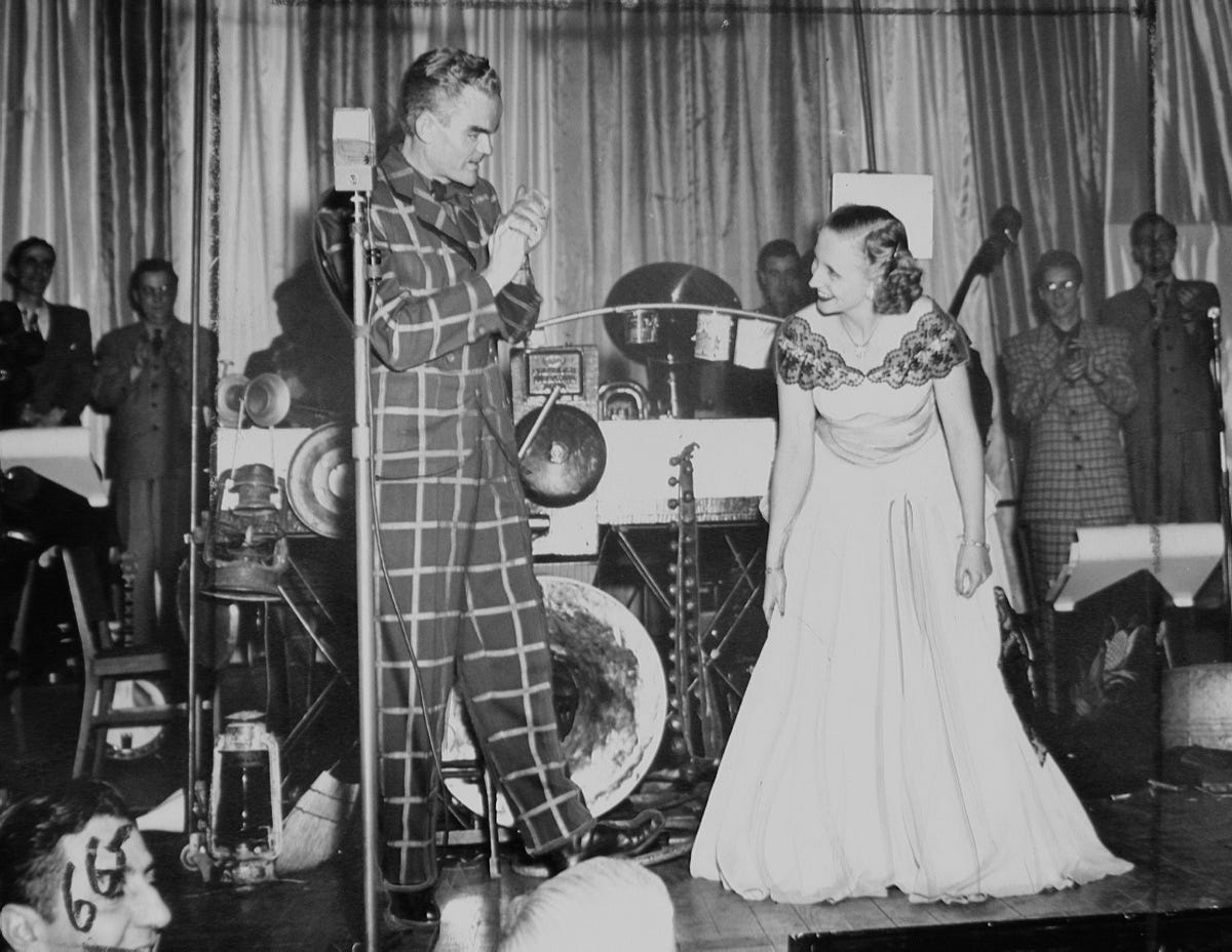 Margaret Truman smiles and curtsies for band leader Spike Jones as he applauds her singing at the annual dinner of the White House Correspondents Association in Washington on March 8, 1948. Margaret Truman smiles and curtsies for band leader Spike Jones as he applauds her singing at the annual dinner of the White House Correspondents Association in Washington on March 8, 1948.