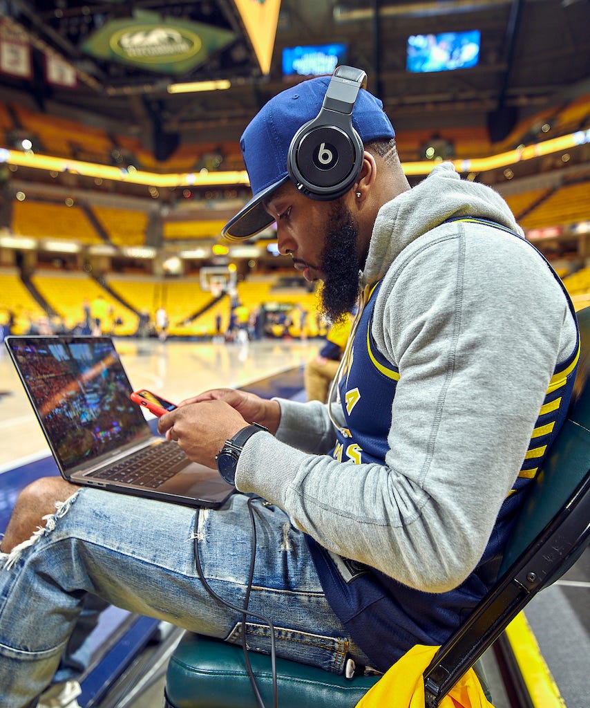 Before each Pacers game, DJ Bandcamp sits courtside as he prepares music for that night. (Photo: DJ Bandcamp)