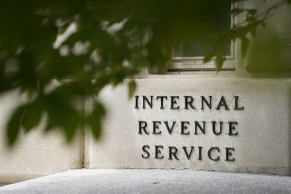 The sign outside the Internal Revenue Service building is seen. May 4, 2021, in Washington. (AP Photo/Patrick Semansky, File)