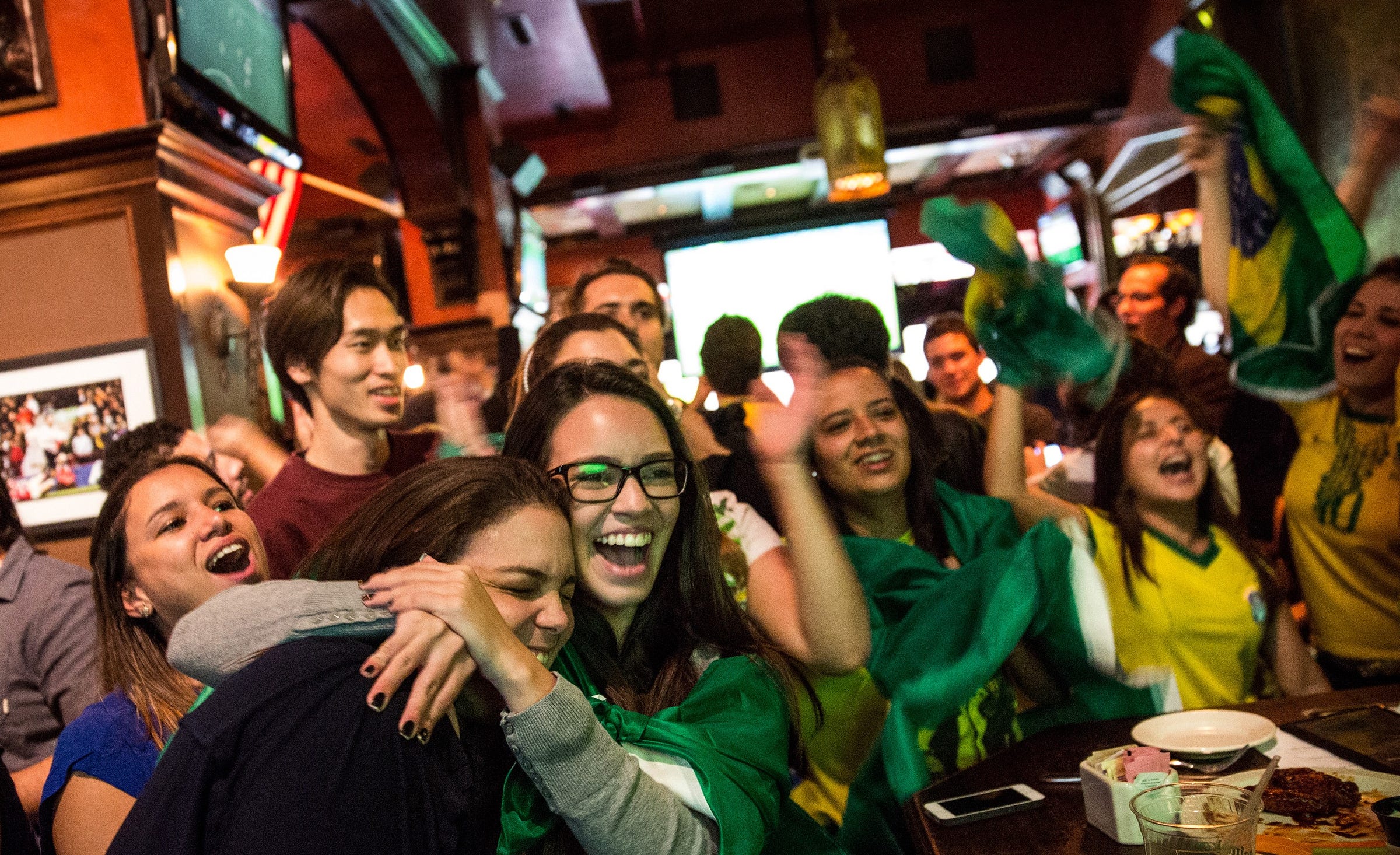 fans gather in a bar to watch the World Cup