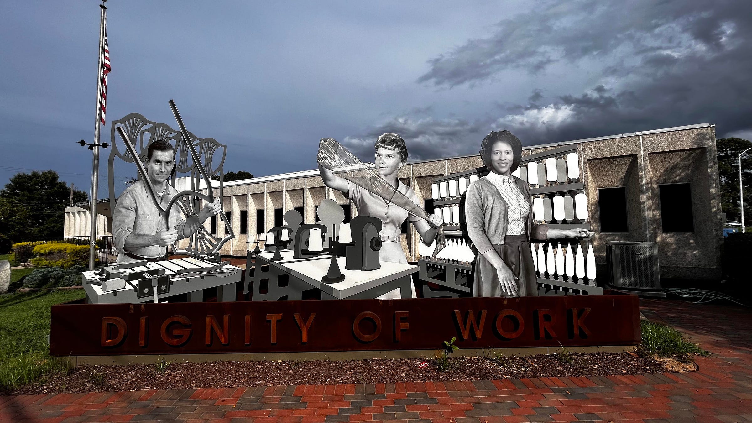 Image of the Dignity of Work Monument in Morganton, North Carolina, featuring Claude Moore, Mary Warlick, and Anne Ramsuer.