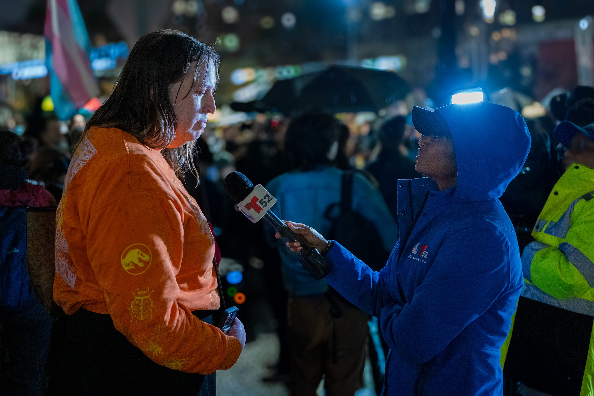 A news anchor from T52 /NBC4 interviews a protestor