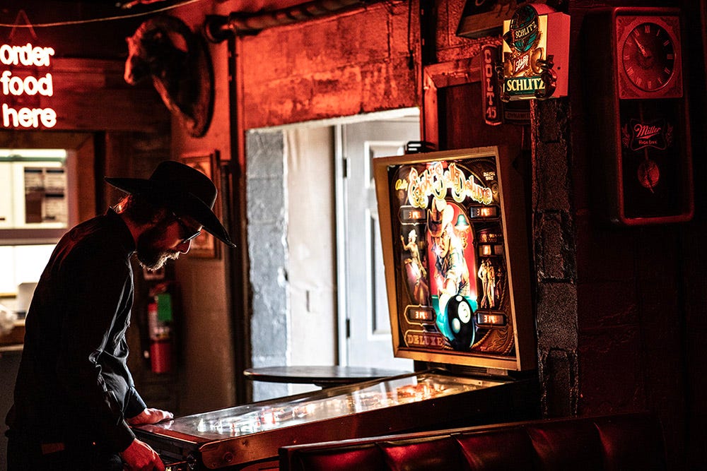 Garrett T. Capps plays the Eight Ball at the Lonesome Dove. Photo by Kirk Weddle