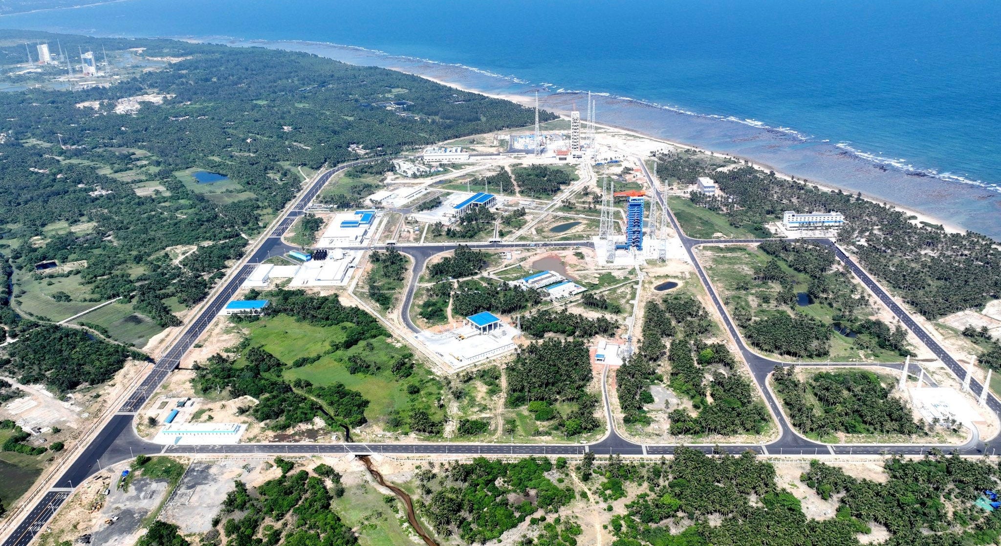 Wenchang Commercial Space Launch Site as seen from above, with the Wenchang Space Launch Site off in the top left, in early July 2024.