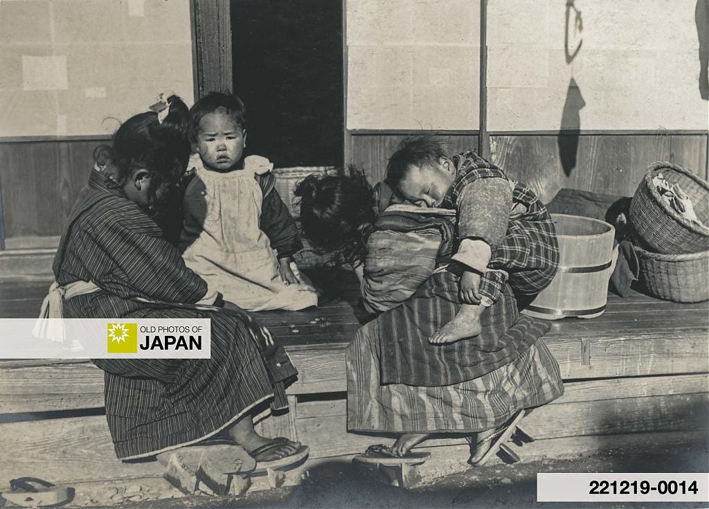 Young Japanese komori nursemaids playing while caring for younger children, 1910s
