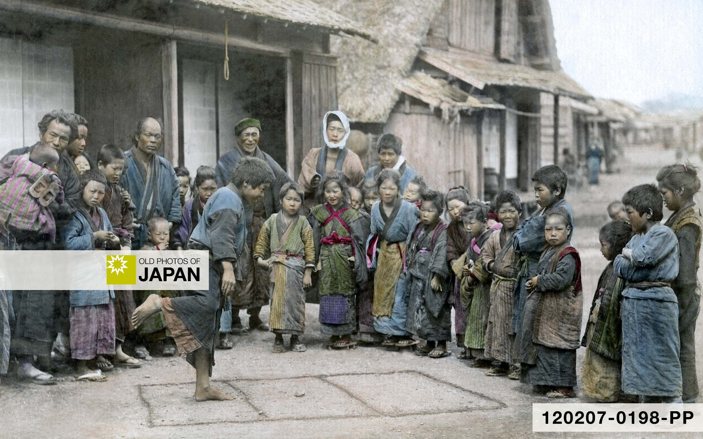 A boy playing hopscotch (石けり) in a Japanese village, 1890s