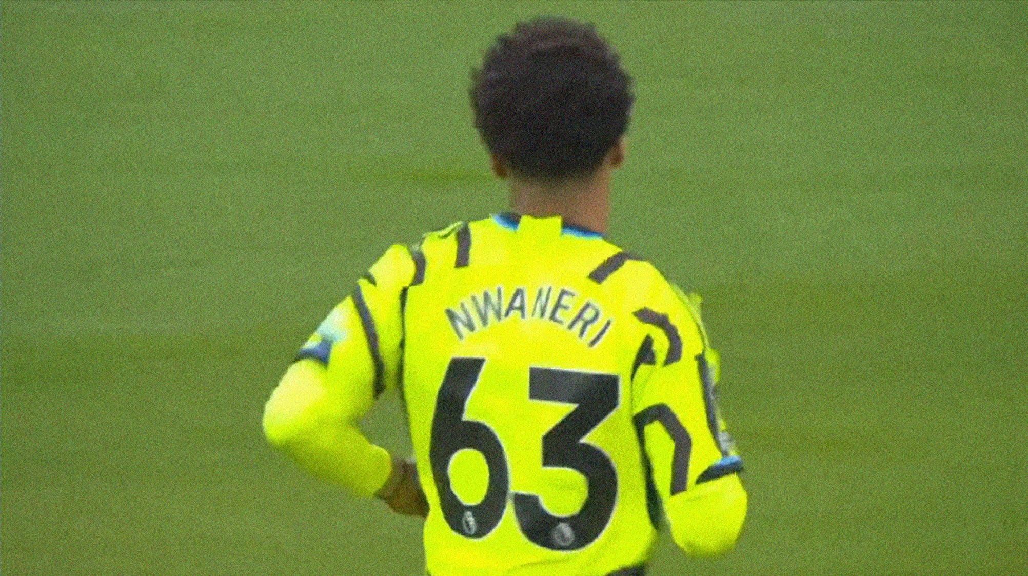 A screenshot of Ethan Nwaneri wearing a highlighter yellow Arsenal kit with 'Nwaneri 63' in black type on the back.