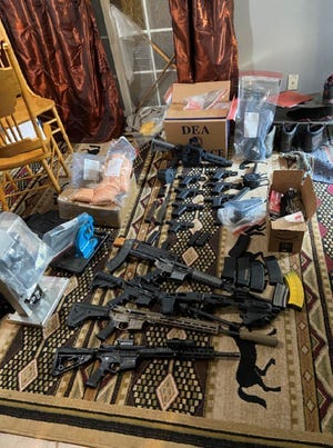 A Battle Creek man will spend up to a decade in prison for possessing more than four kilograms of methamphetamine and machine guns, shown here.