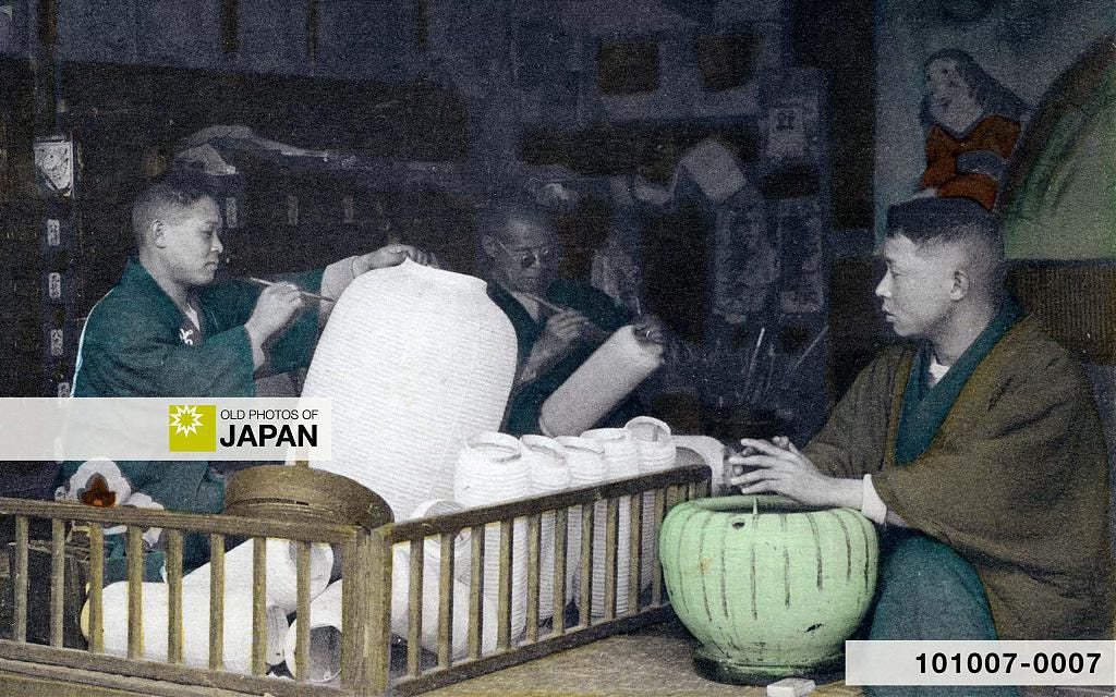 Japanese man warming his hands over a ceramic hibachi Japanese man warming his hands over a ceramic hibachi