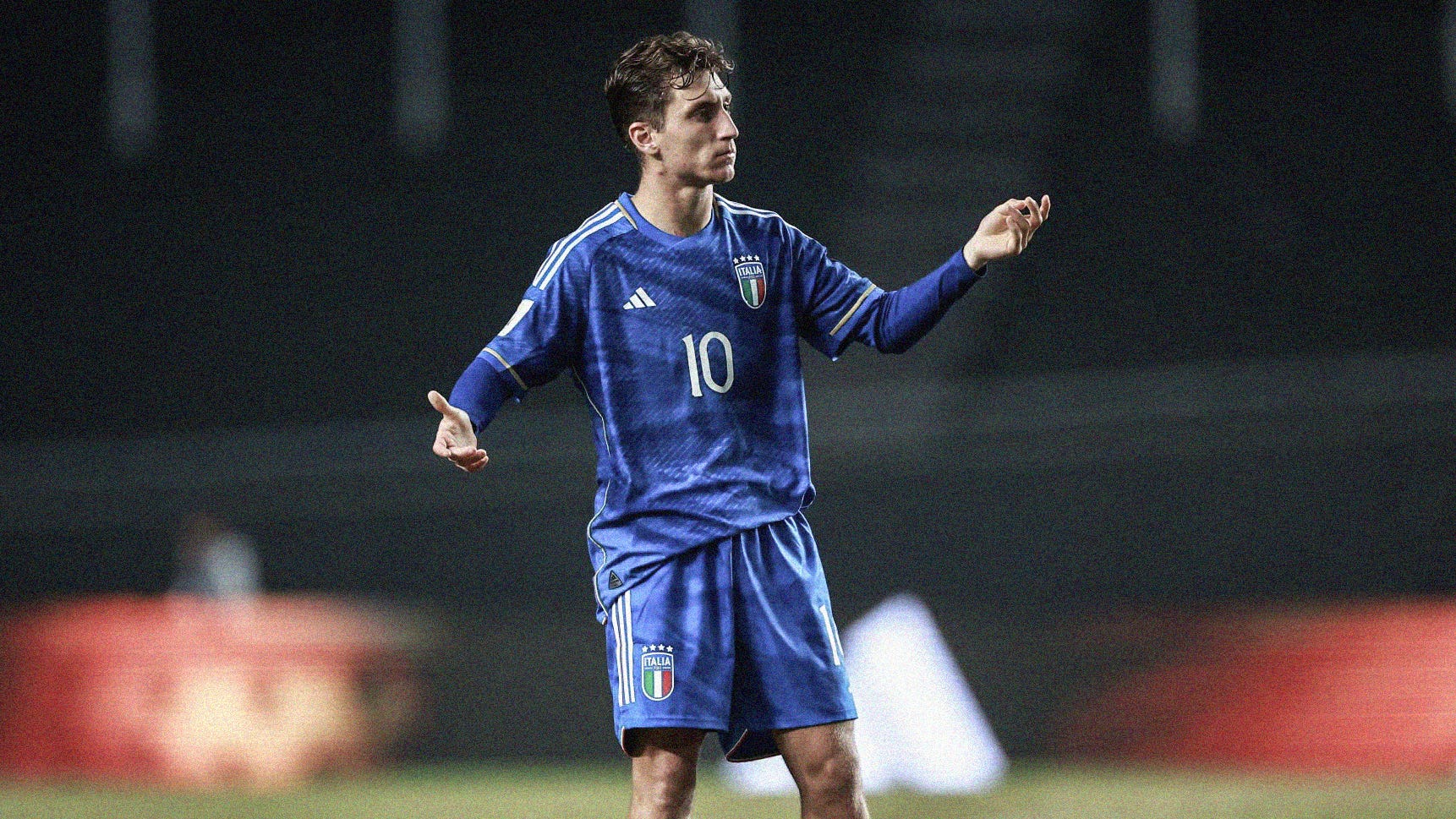 A photo of Italy's Tommaso Baldanzi stood with his arms out at the 2023 FIFA U-20 World Cup