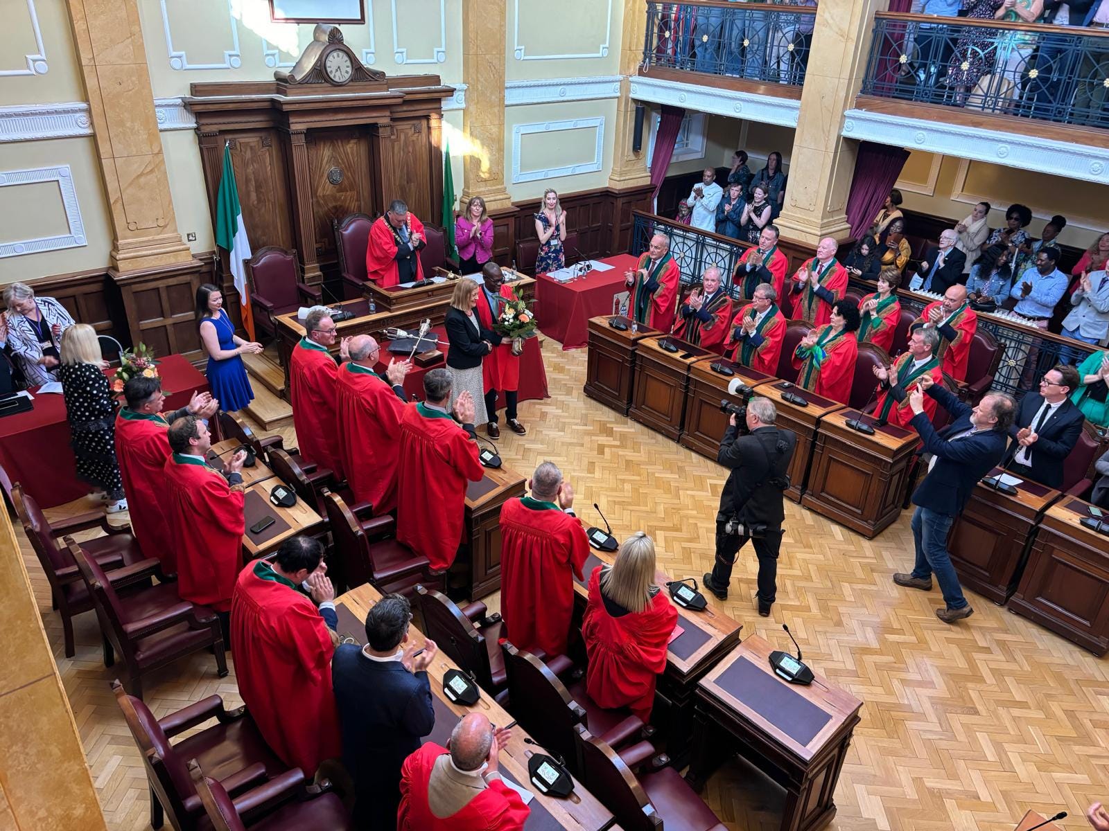 The election of the first Green Party Lord Mayor of Cork, Dan Boyle, and the presentation of flowers to the out-going Deputy Lord Mayor of Cork, Colette Finn, by the in-coming Deputy Lord Mayor, Honoré Kamegni.