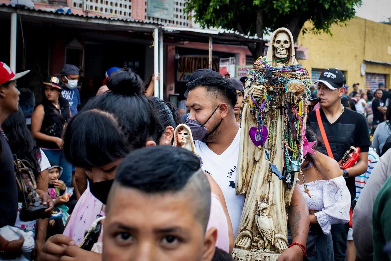 Devotees of Santa Muerte, patron saint of narcos, at a mass in Tepito. (Photo: Václav Lang)