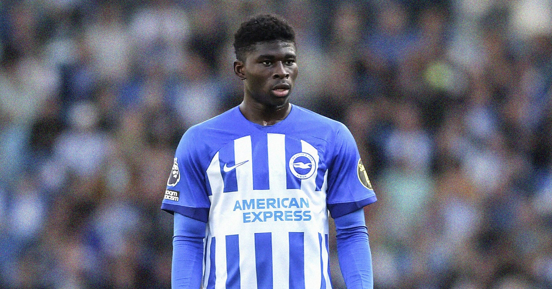 A photo of Carlos Baleba in a blue-and-white Brighton kit