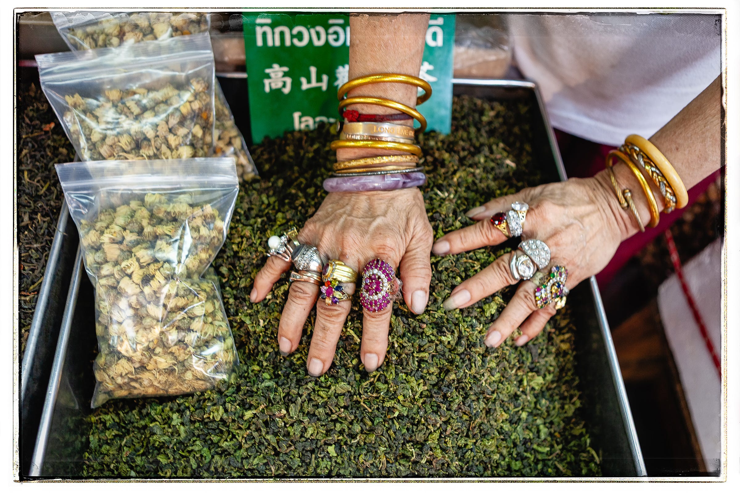 Tea vendor, Chinatown, Bangkok, Thailand. 1/25, f/2.8, ISO 400, 24mm