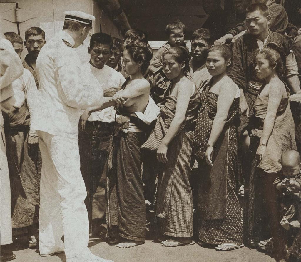 Japanese emigrants aboard a Pacific steamship en route to Hawaii get vaccinated, 1904