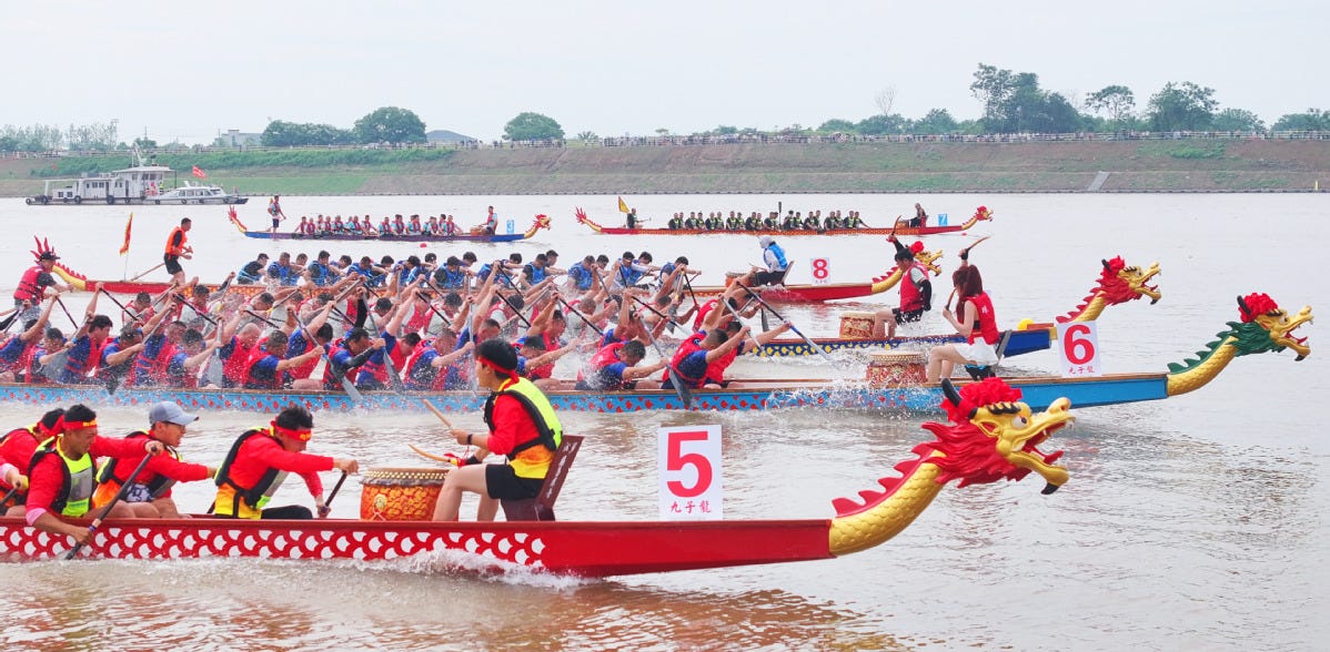 A dragon boat race takes place on the Xiangjiang River in Hengyang, Hunan Province. A dragon boat race takes place on the Xiangjiang River in Hengyang, Hunan Province.