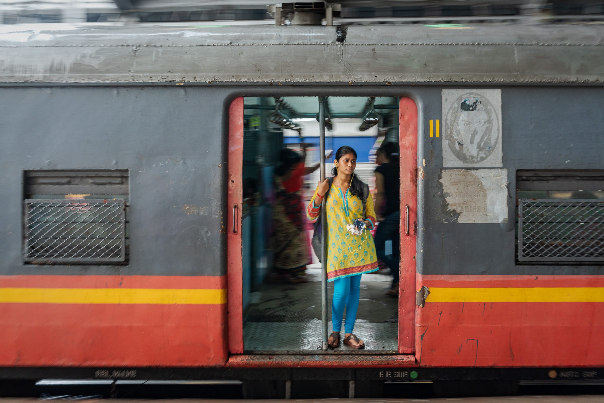 I wonder what she was listening to as her journey began — 1/30th, f/4.5, ISO800, 35mm