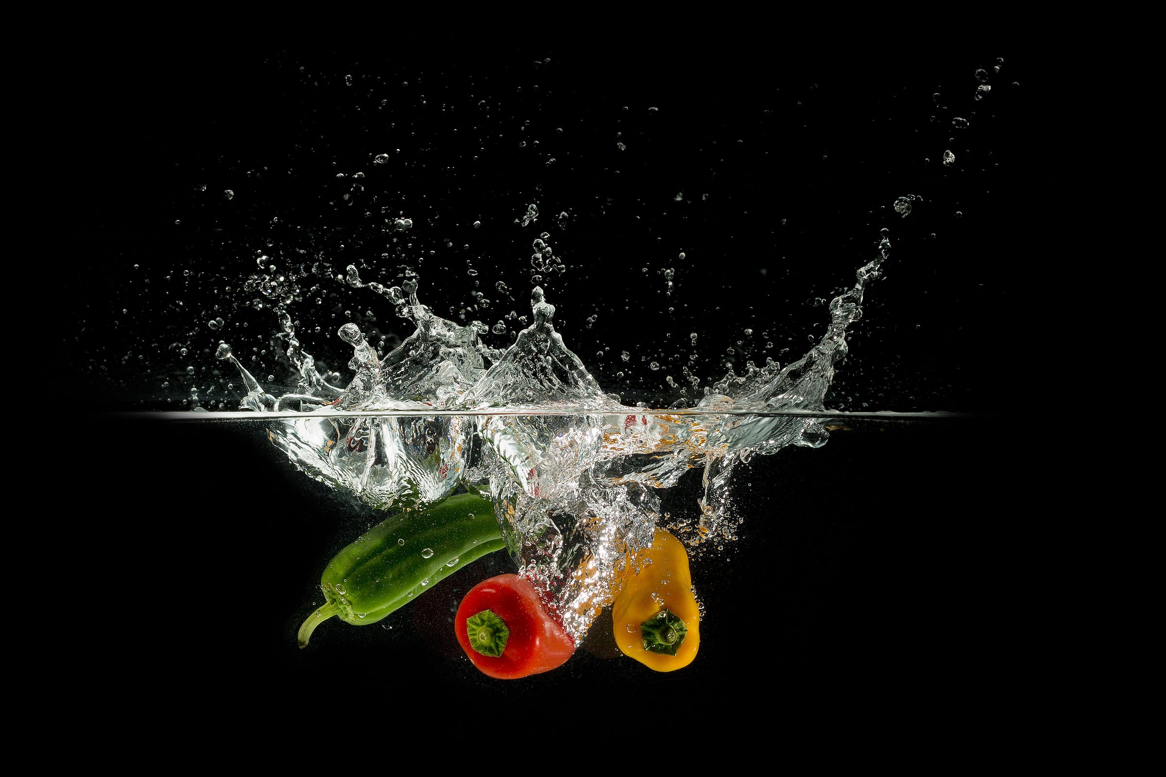 Colorful vegetables plunging into water (because I couldn't find a good pic of an immersion blender)