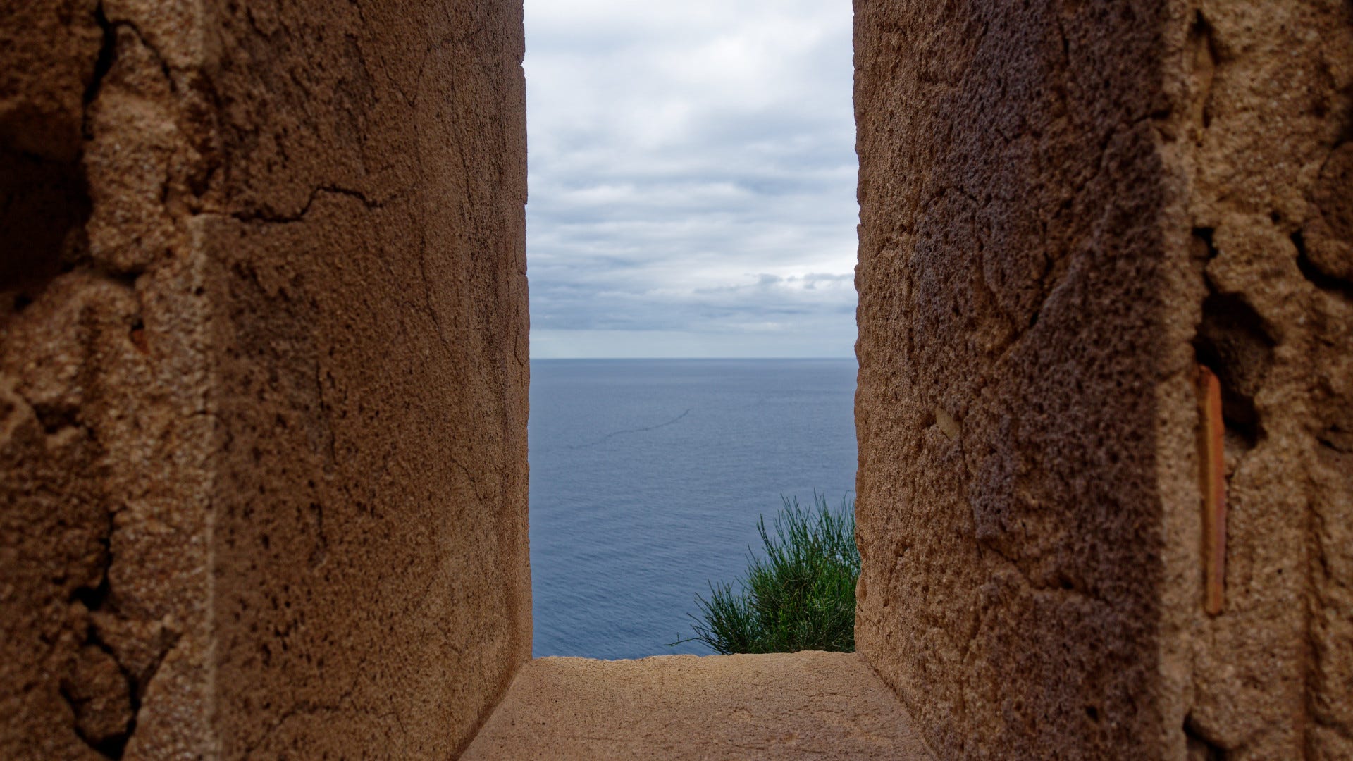 View of the sea through the Torre Cala en Basset watchtower near Sant Elm
