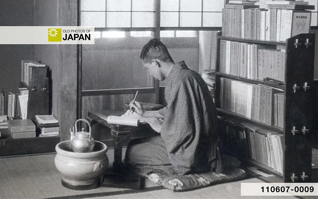 Japanese university student studying next to a simple Seto hibachi, 1929 Japanese university student studying next to a simple Seto hibachi, 1929
