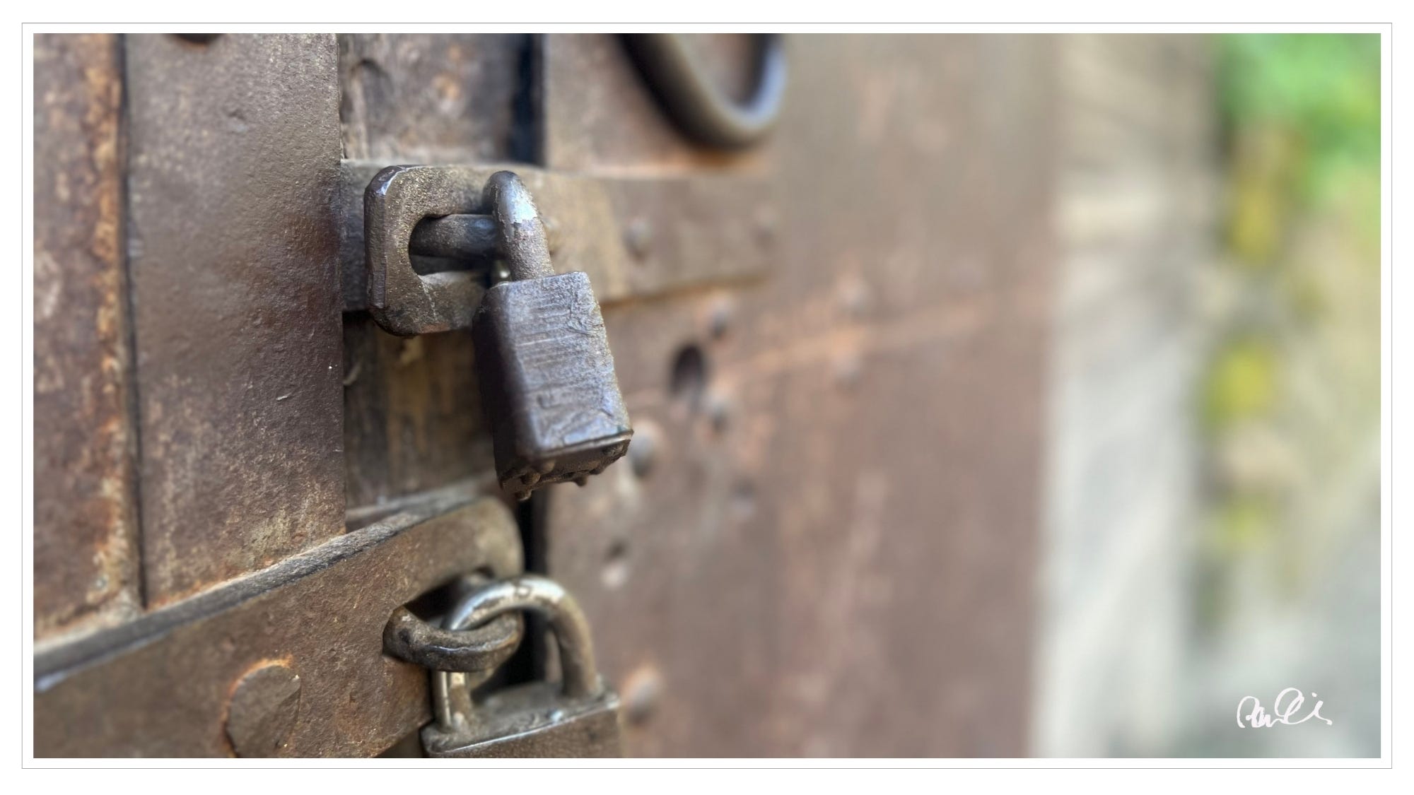 Rusted steel doors and locks, old jail house
