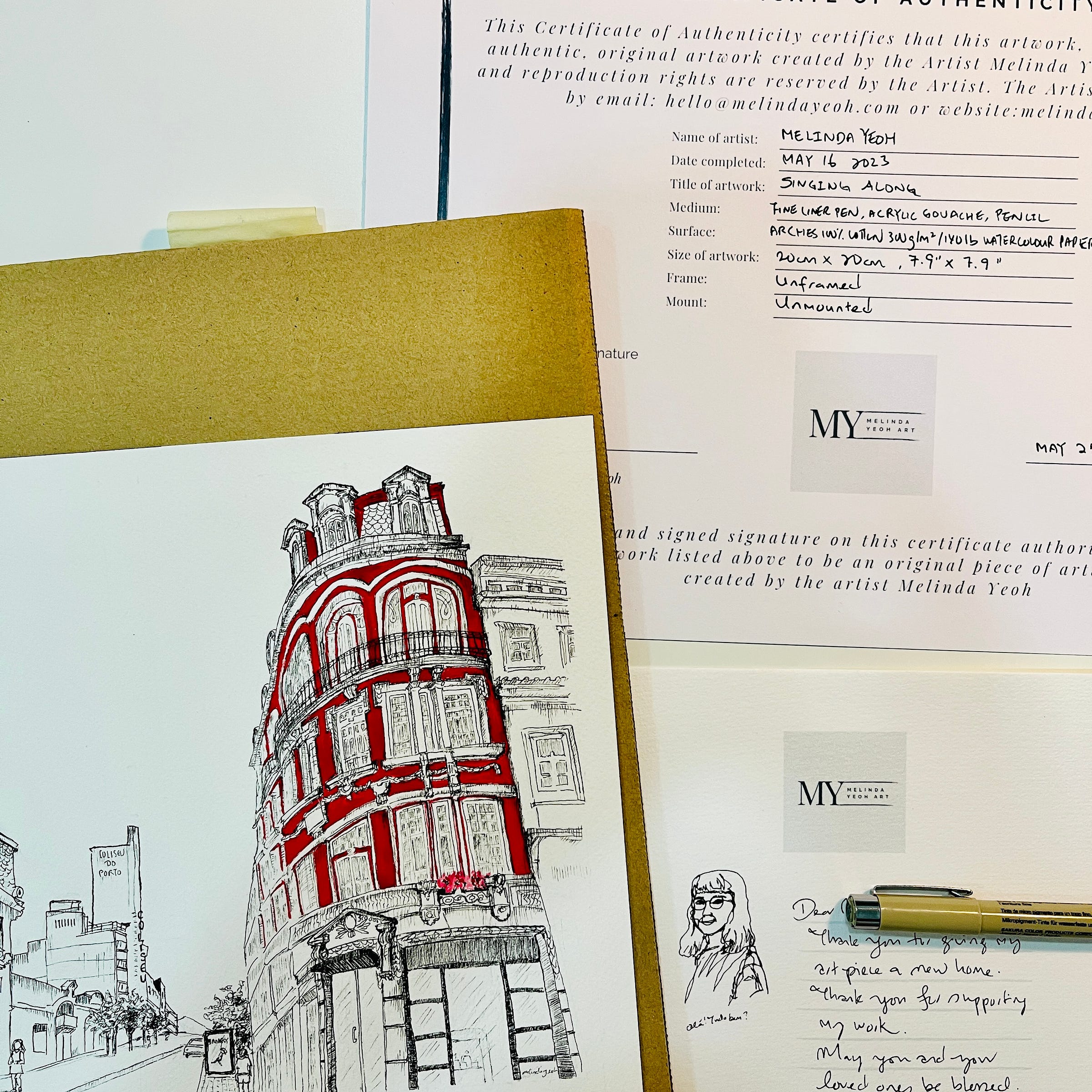 Image: photo of an urbanscape architecture line drawing with acrylic gouache paint, with a certificate of authenticity and a handwritten note to the art buyer. It shows buildings along the street of Porto, where the Coliseum of Porto can be seen in the background.