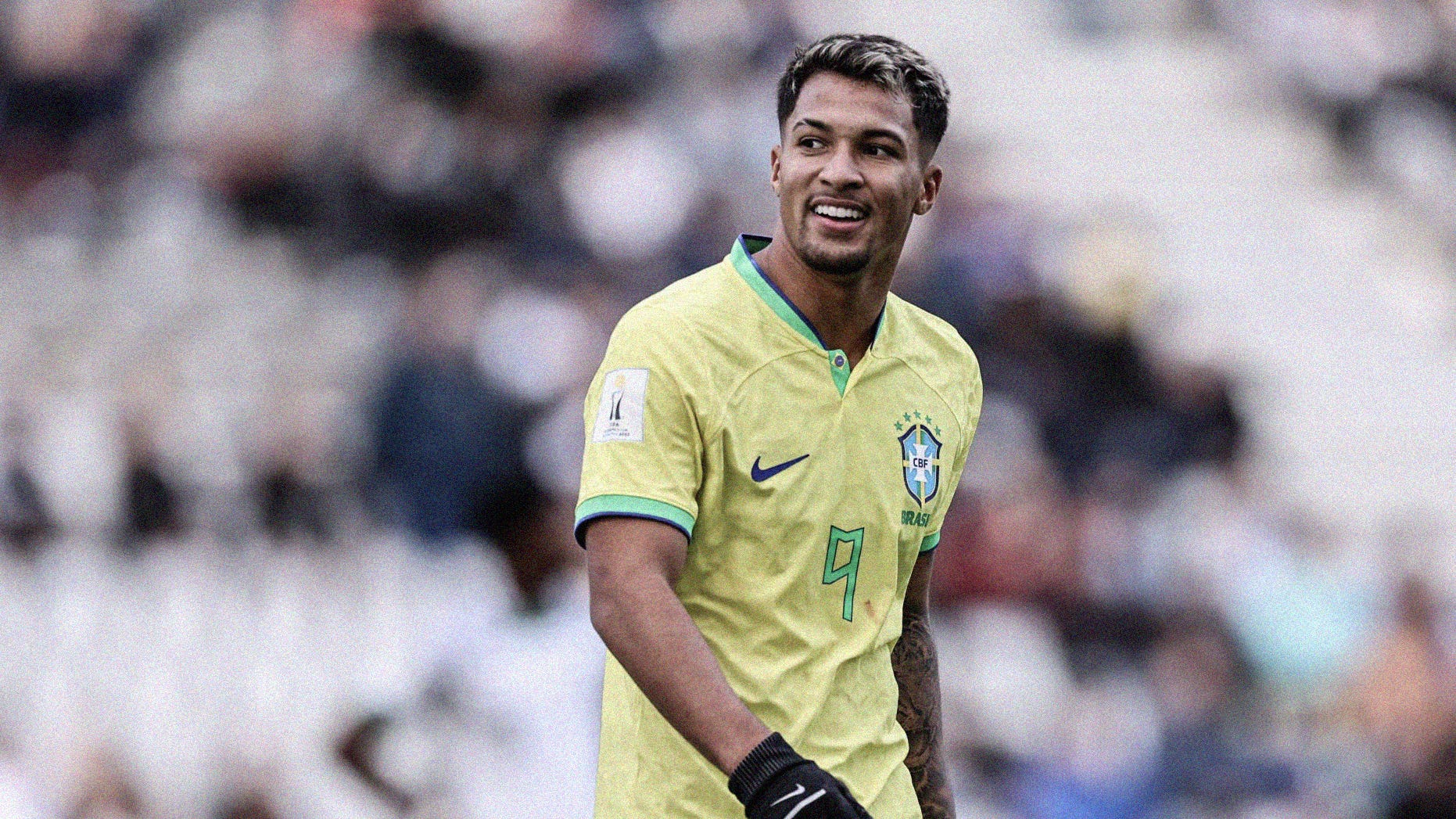 A photo of Brazil's Marcos Leonardo smiling, wearing gloves, at the 2023 FIFA U-20 World Cup