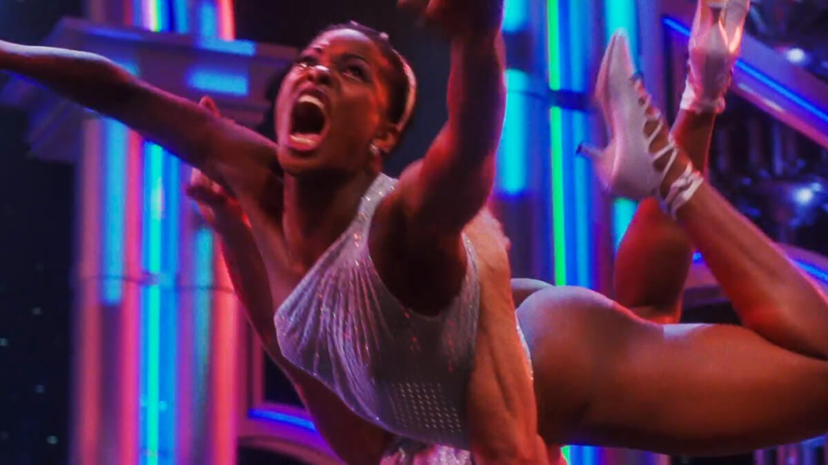 Annie, the backstabbing understudy, mid-swan dive during one of Goddess' musical numbers—arms and legs flailing, mouth agape in a scream. Annie, the backstabbing understudy, mid-swan dive during one of Goddess' musical numbers—arms and legs flailing, mouth agape in a scream.
