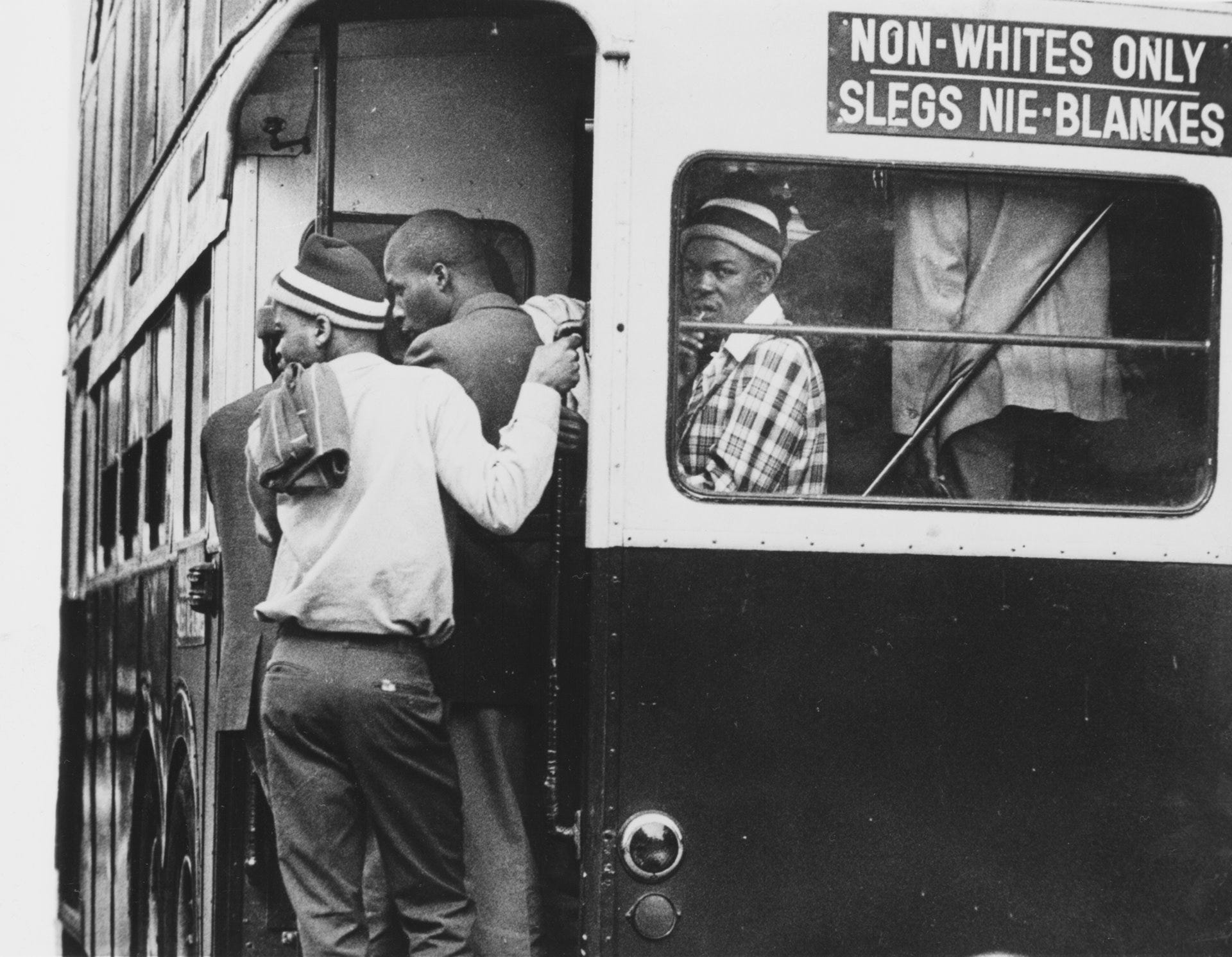 A bus segregated by race in South Africa, 1976. © Ernest Cox Jr. for the Chicago Tribune