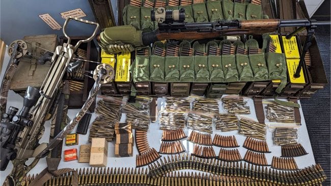 South Australian Police have seized a massive weapons hall including a semi-automatic rifle, crossbow, 4,000 rounds of ammunition, and an inert explosive. Picture: SA Police.