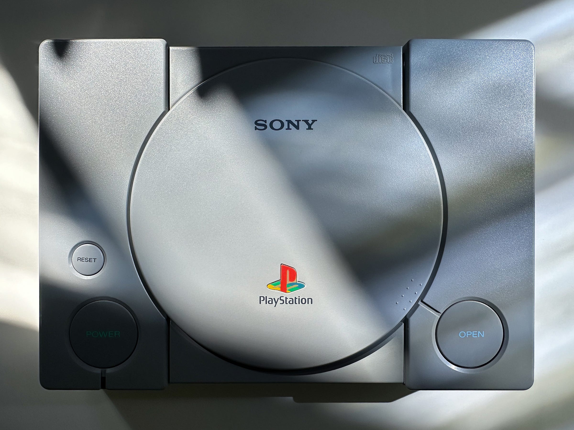 Moody, shadowy photograph of the original PlayStation.