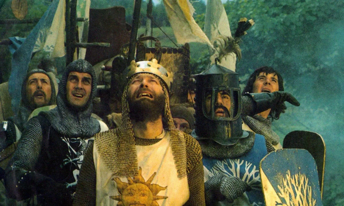 A scene from Monthy Python and the Holy Grail film, where knights are looking up to the sky aghast.
