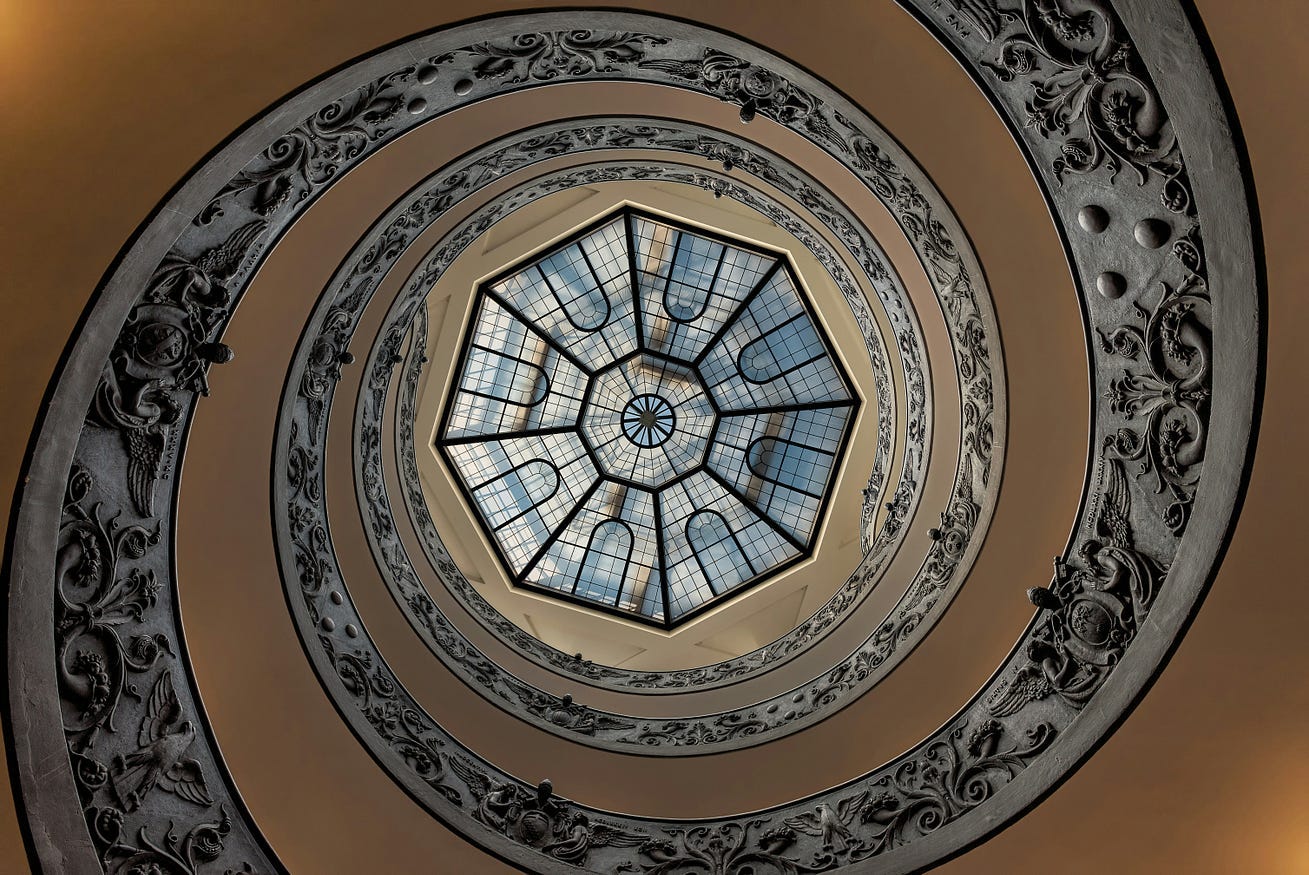 A spiraling ceiling to a hexagon