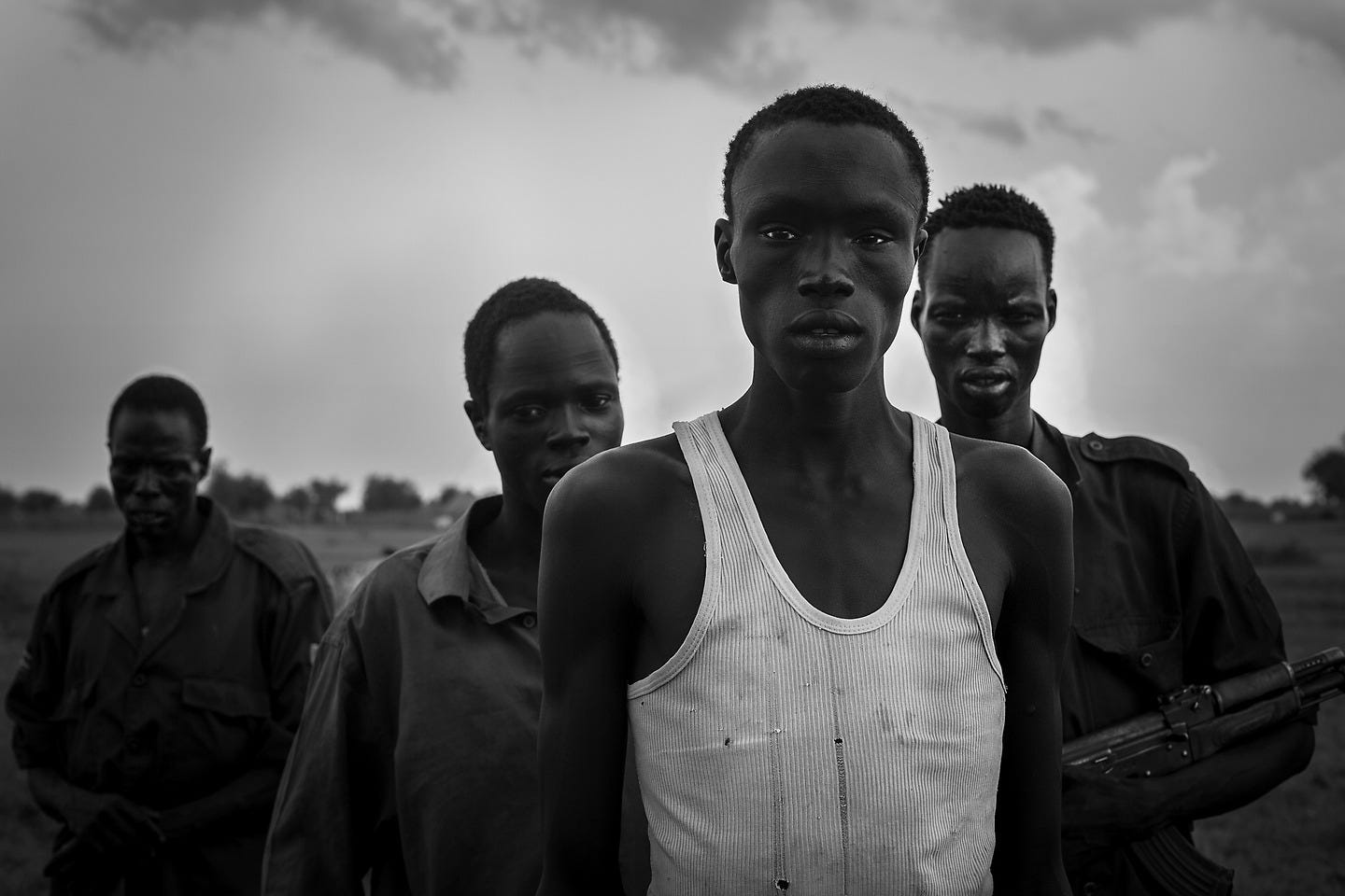 “The youth managed to get organised throughout Uror and Akobo county by word of mouth. Each of them is being told what to bring, and when the green light is given, they have a few hours to pack up and be ready to go. Although this year, the Lou Nuer from Akobo arrived late in Pibor, therefore didnt manage to get as much cattle as they wanted. Theyre expected to go back to Pibor county to get what they missed”. From ‘Vanishing Youth’. © Camille Lepage