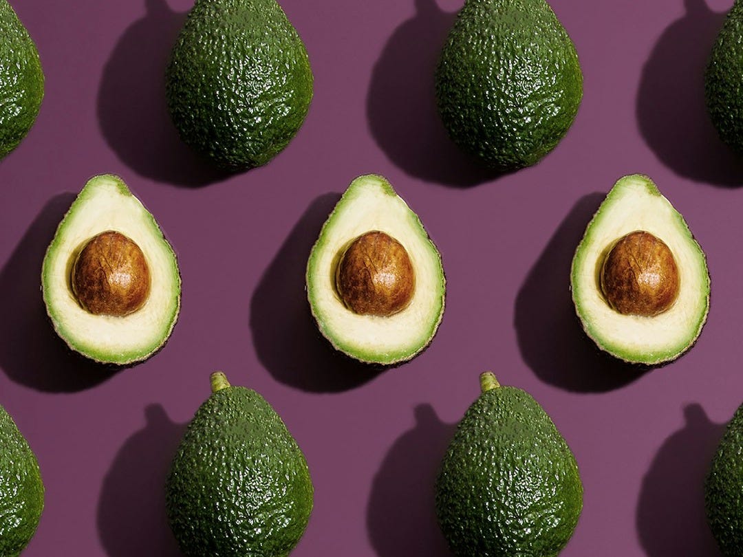 sliced green fruit on purple background