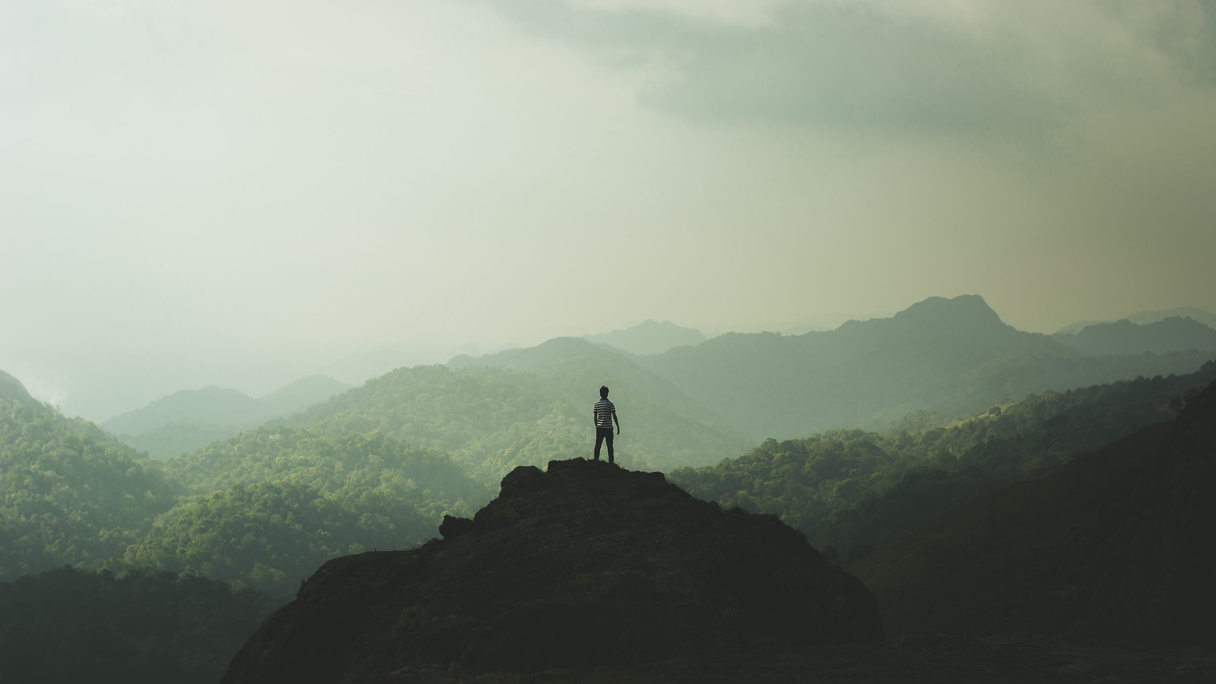 A man standing on a mountaintop