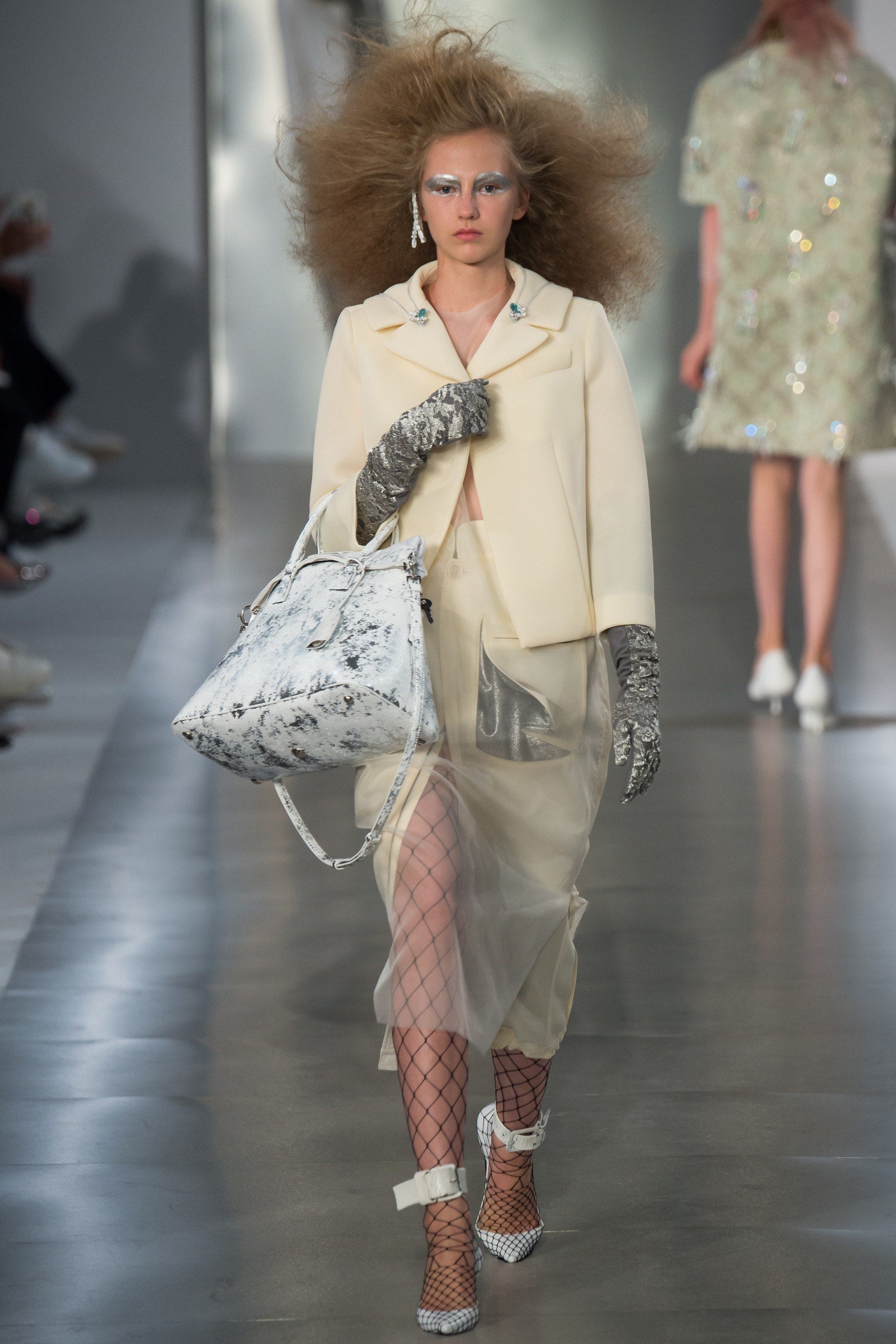 Image may contain Clothing Apparel Human Person Hair Female Woman Sleeve Footwear and Shoe