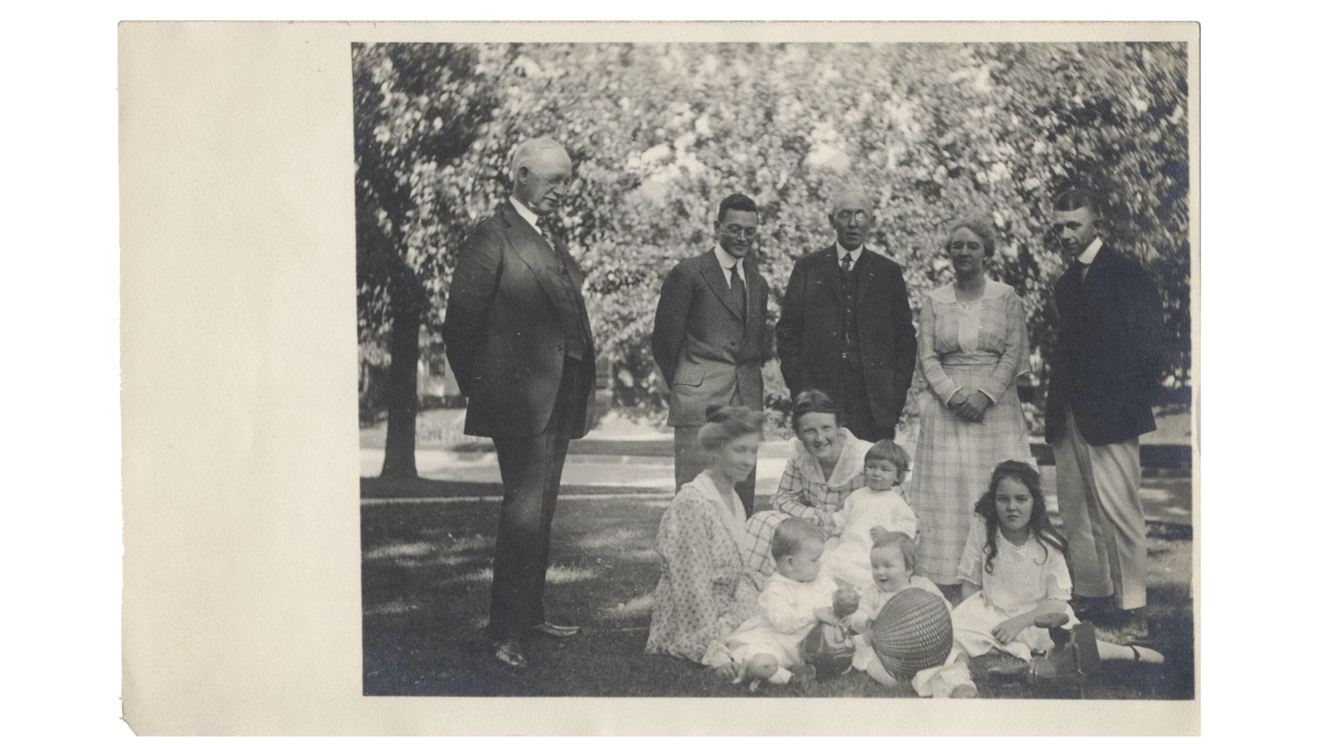 A family gathering on the lawn for a photo in the early 19th century. All Rights Reserved.