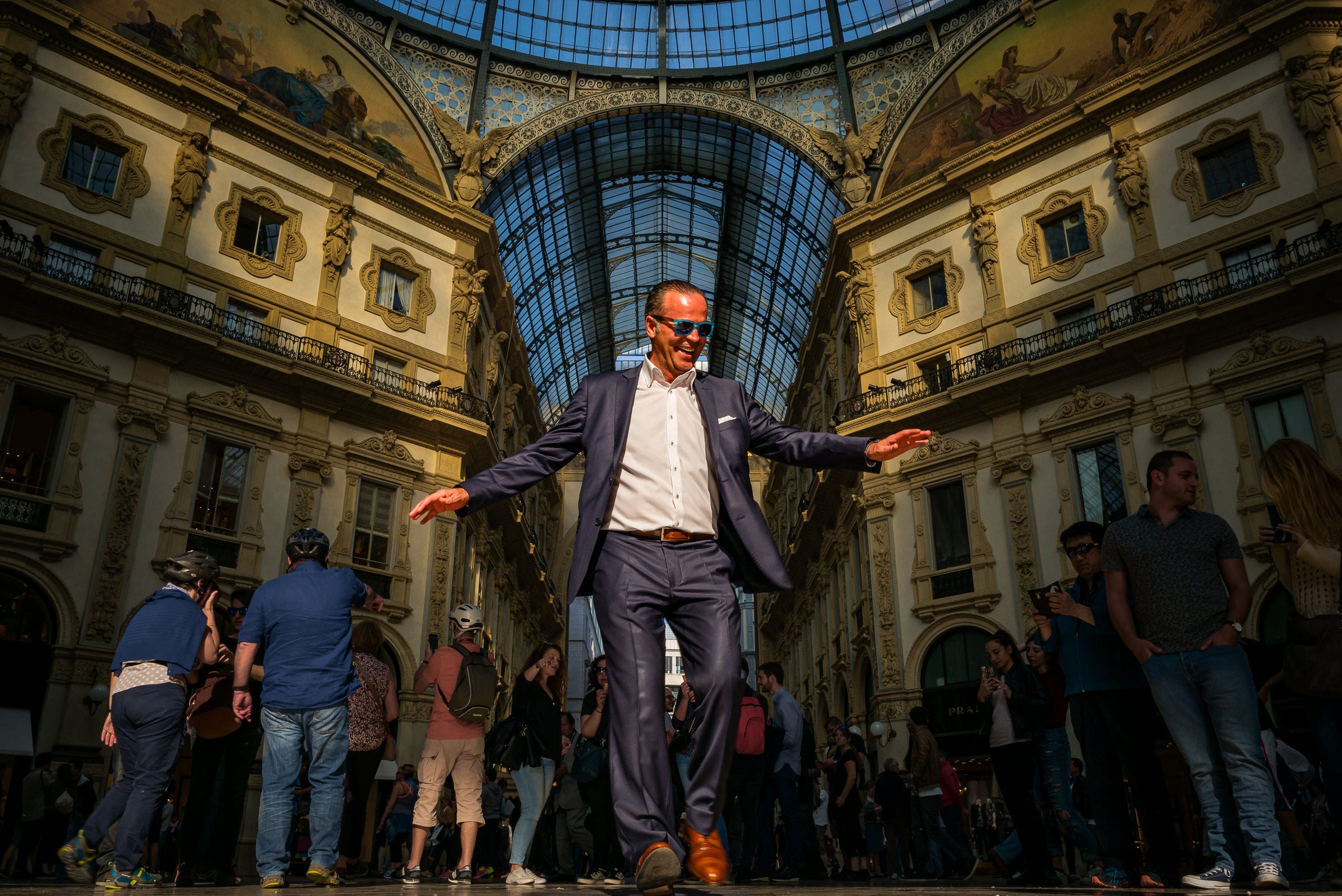 Spinning three times on the famous torino mosaic in Galleria Vittorio Emanuele II, Milan, Italy (1 /125, f/16, ISO 400, 28mm)