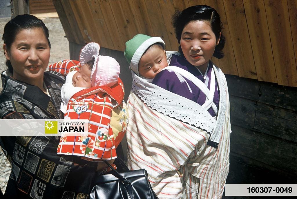 Two Japanese mothers with children in Kyoto, 1950s