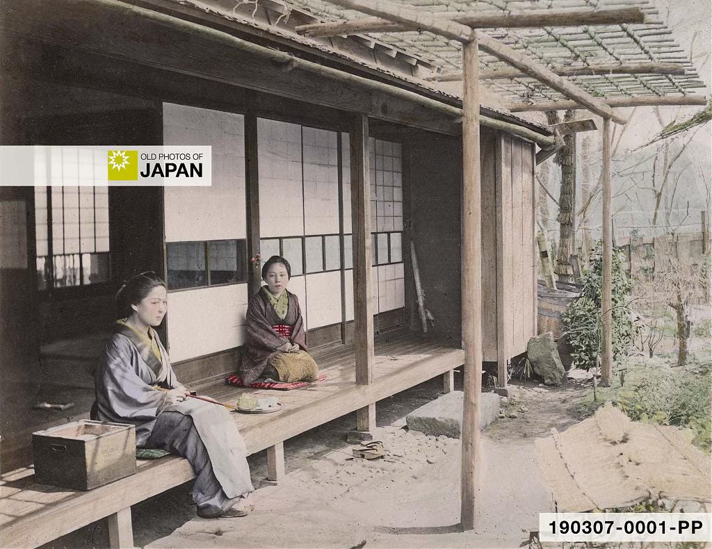 Two Japanese women in kimono are sitting on the engawa of a traditional Japanese house, 1890s Two Japanese women in kimono are sitting on the engawa of a traditional Japanese house, 1890s