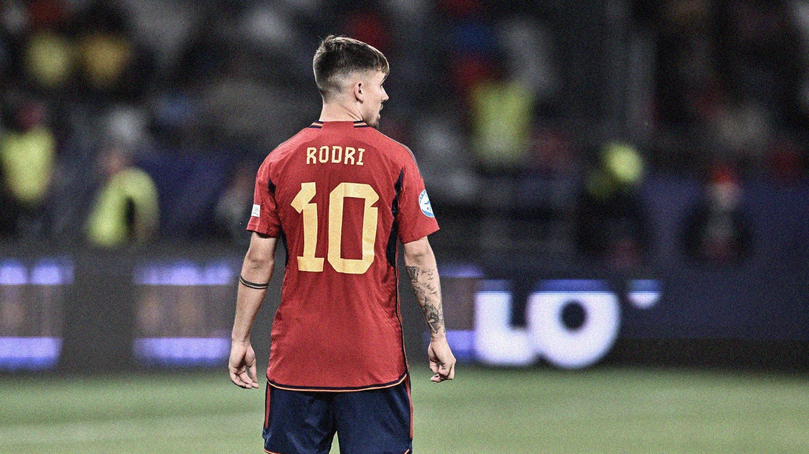 A wide-frame photo of Spain's Rodri Sánchez from behind, focussing on the 'Rodri 10' decals on his shirt